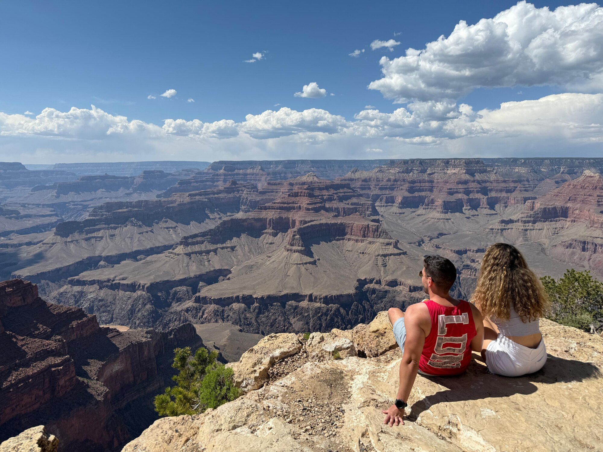 Foivos and Alexandra looking across a canyon landscape