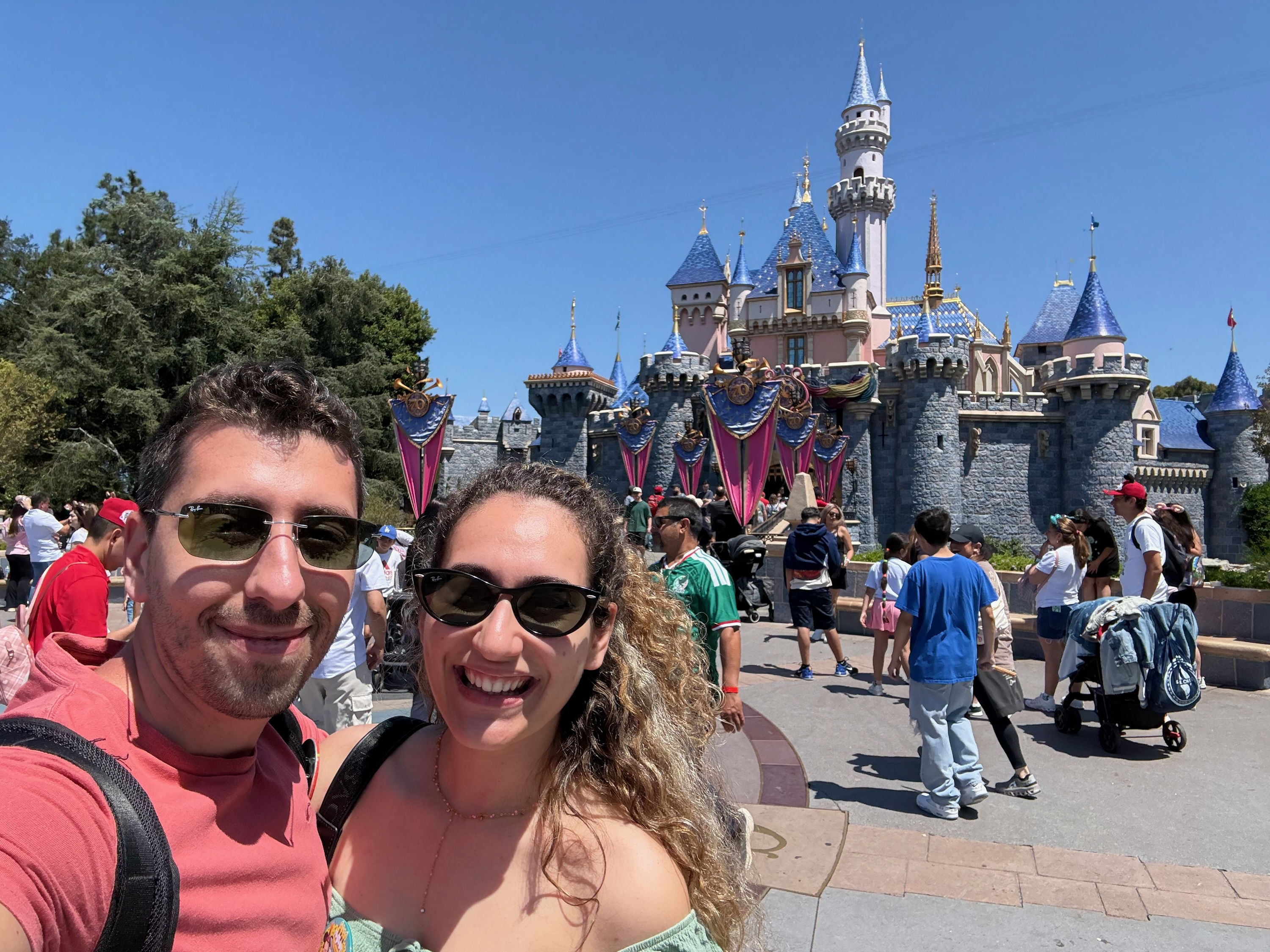 Foivos and Alexandra in front of the castle at Disneyland