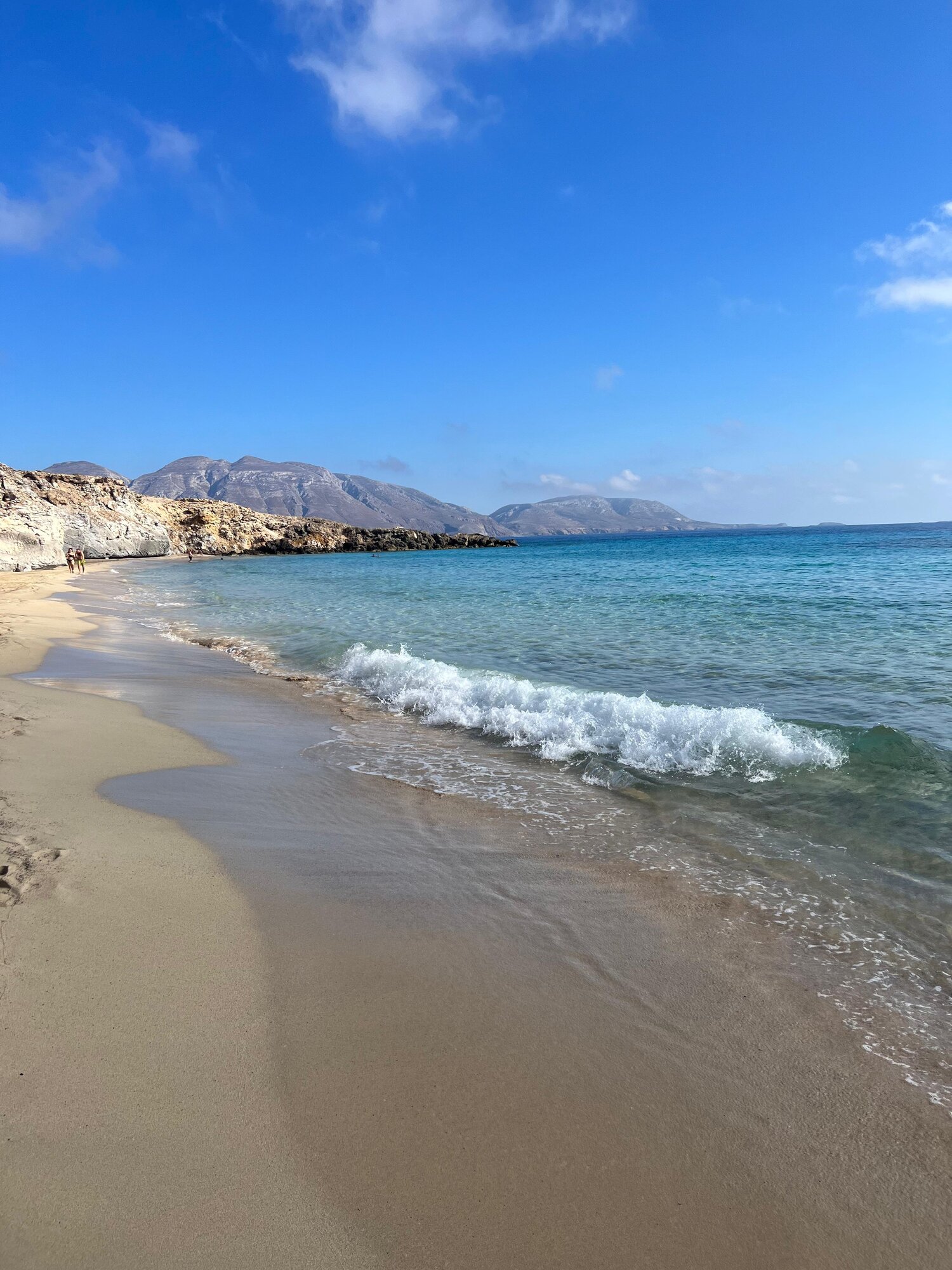 The sandy shore and clear water of Marmara beach on Armathia